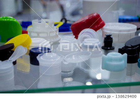 Different plastic products. Products made of multi-colored plastic. Models set of various plastic products made of plastic. Multicolored objects. 138629400
