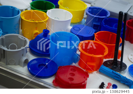 Plastic products. Products made of multi-colored plastic. Models plastic mounting boxes made of plastic. Multicolored objects 138629445