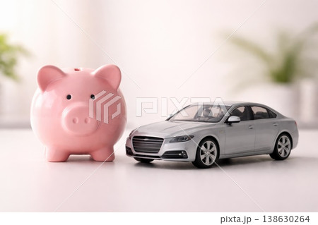 Piggy bank next to modern car model financial planning concept 138630264