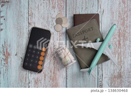 Travel planning essentials with passport and calculator Travel planning essentials with passport and calculator 138630468