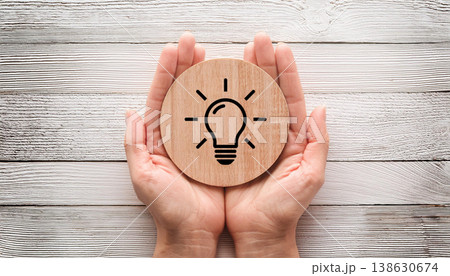 Idea and Creativity Concept , Light Bulb Icon Held in Hands Idea and Creativity Concept , Light Bulb Icon Held in Hands 138630674