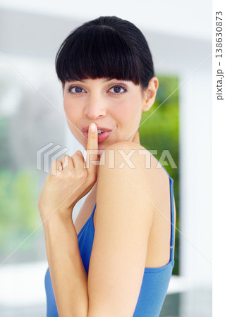 Secret, gossip and portrait of woman at her home with finger on her mouth in her modern home. Whisper, silence hand gesture and young female person from Canada with quiet or hush expression in house. 138630873