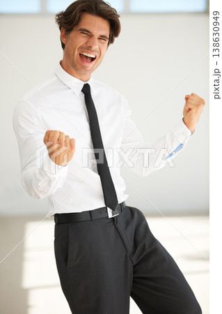 Business man, portrait and celebrate success in office of investment profit, promotion and winning deal. Happy corporate worker, winner and shouting with fist for celebration, cheers and bonus reward Business man, portrait and celebrate success in office of investment profit, promotion and winning deal. Happy corporate worker, winner and shouting with fist for celebration, cheers and bonus reward 138630949