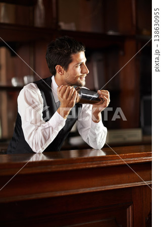 Shake, mixer and bartender with a cocktail, drink or chat with customer in dark club at night. Mixing, alcohol and face of barman with vodka or liquor in metal container for a strong beverage in bar 138630955