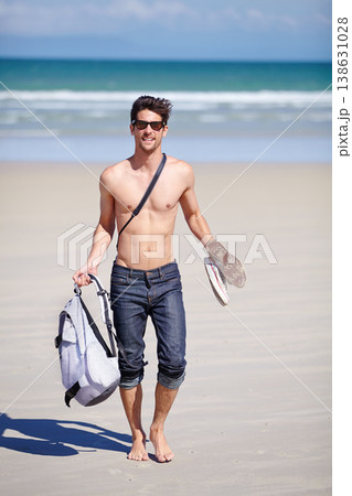 Portrait, walking and the body of a man on the beach for travel, freedom or adventure on vacation. Summer, sand and sunglasses with a young person shirtless by the ocean or sea for a coastal holiday Portrait, walking and the body of a man on the beach for travel, freedom or adventure on vacation. Summer, sand and sunglasses with a young person shirtless by the ocean or sea for a coastal holiday 138631028