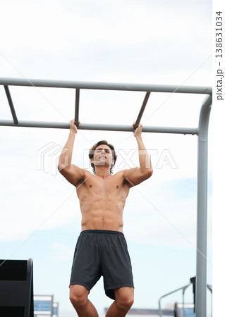 Pull up bar, outdoor and man exercise for muscle building, body builder performance or strength development. Muscular, fitness training and strong athlete for workout, challenge or active practice 138631034