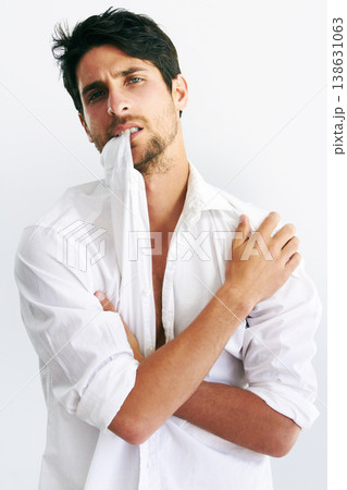 Portrait, fashion and man biting collar in studio isolated on a white background. Face, style and confidence of serious model, handsome and attractive person in trendy clothes, body or cool in Spain Portrait, fashion and man biting collar in studio isolated on a white background. Face, style and confidence of serious model, handsome and attractive person in trendy clothes, body or cool in Spain 138631063