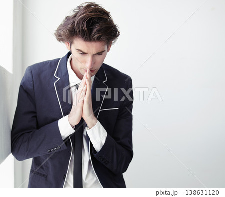 Thinking, mistake and a businessman with a prayer in the office for support, hope and trust. Serious, idea and a young corporate employee with spiritual help for a decision or fail in the workplace 138631120