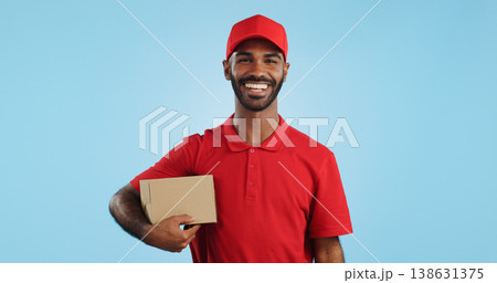 Happy man, box and delivery in transport service, package or order in studio against a blue background. Portrait of male person or courier guy smile with parcel, cargo or logistics on mockup space Happy man, box and delivery in transport service, package or order in studio against a blue background. Portrait of male person or courier guy smile with parcel, cargo or logistics on mockup space 138631375