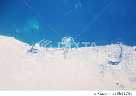 Earth, satellite and landscape, map of desert and Dubai, water and sand in environment, nature and geography. Aerial view, country and terrain, ocean or sea from space with city, island or coastline Earth, satellite and landscape, map of desert and Dubai, water and sand in environment, nature and geography. Aerial view, country and terrain, ocean or sea from space with city, island or coastline 138631786