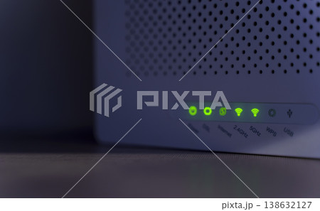 WiFi Router with Green LED Indicators Showing Active Connection WiFi Router with Green LED Indicators Showing Active Connection 138632127