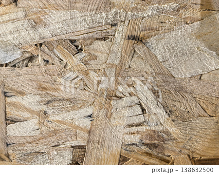 Close-up texture of an Oriented Strand Board (OSB) panel. Close-up texture of an Oriented Strand Board (OSB) panel. 138632500