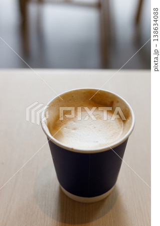 Cup of hot milk latte coffee on table by the window. Cup of hot milk latte coffee on table by the window. 138634088