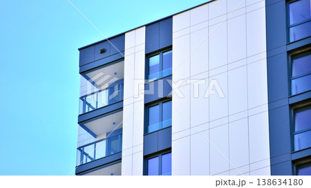Exterior of a high modern multi-story apartment building - facade, windows and balconies. Exterior of a high modern multi-story apartment building - facade, windows and balconies. 138634180