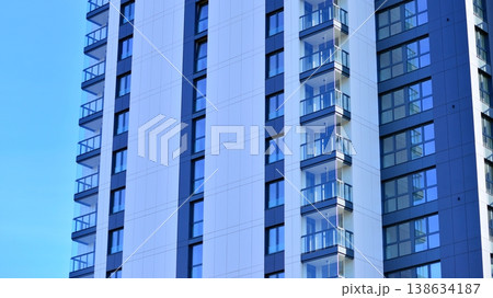 Exterior of a high modern multi-story apartment building - facade, windows and balconies. 138634187