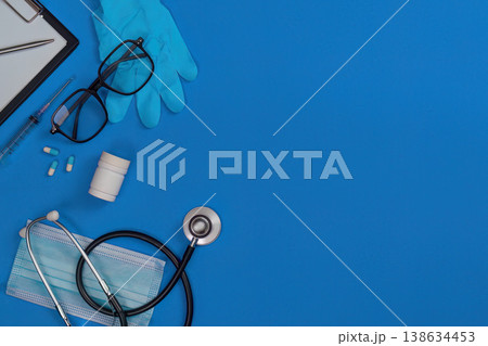 Healthcare tools and accessories on blue background Healthcare tools and accessories on blue background 138634453