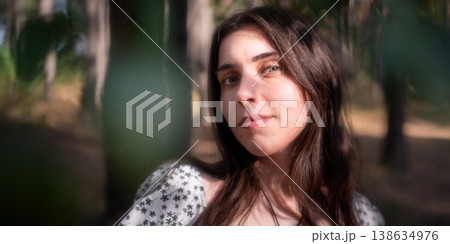 Soft close portrait of young woman in woodland 138634976