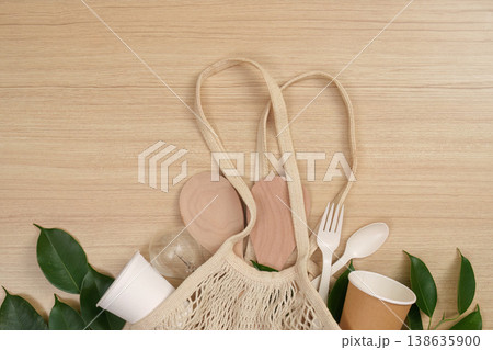 Reusable bag with eco-friendly items and leaves 138635900