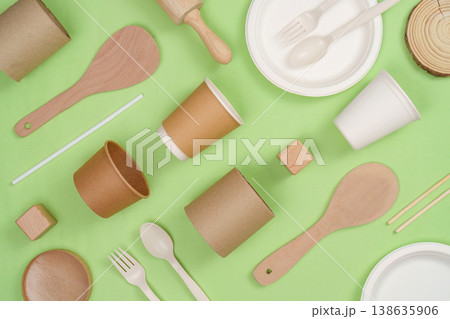 Sustainable tableware on green background Sustainable tableware on green background 138635906