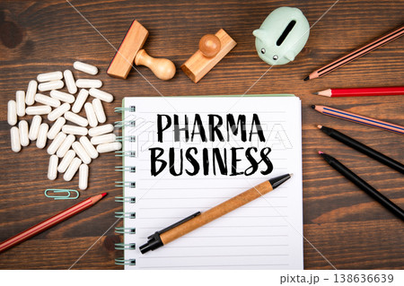 PHARMA BUSINESS Notebook With Capsules Stamps And Stationery On Desk PHARMA BUSINESS Notebook With Capsules Stamps And Stationery On Desk 138636639