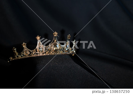 Golden Crown with Citrine Gemstones on Black Background. Luxury Royal Concept. Golden Crown with Citrine Gemstones on Black Background. Luxury Royal Concept. 138637250
