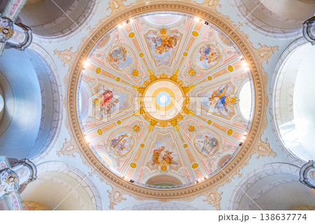 Visitors admire the detailed dome of Frauenkirche in Dresden, Germany. The church interior features intricate designs and colorful artwork. Visitors admire the detailed dome of Frauenkirche in Dresden, Germany. The church interior features intricate designs and colorful artwork. 138637774