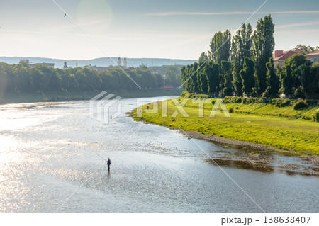 long embankment of the river Uzh in morning light. wonderful urban landscape in early summertime. gorgeous Transcarpathia capital observed from Tomas Masaryk bridge. serene eastern europe metropolis 138638407