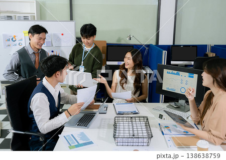 Businessmen team or financial data analysts working with tablets and laptop computers and data graphs together. Businessmen team or financial data analysts working with tablets and laptop computers and data graphs together. 138638759
