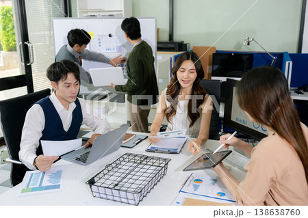 Businessmen team or financial data analysts working with tablets and laptop computers and data graphs together. Businessmen team or financial data analysts working with tablets and laptop computers and data graphs together. 138638760