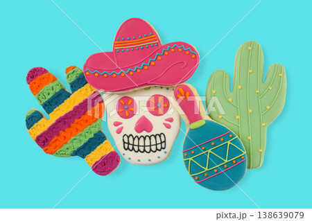 Bright cookies shaped like a skull, cactus, and maraca Bright cookies shaped like a skull, cactus, and maraca 138639079
