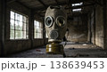Gas mask with broken filter centered in derelict hall with soft daylight beams and long floor lines 138639453