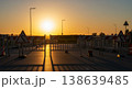 Military watchtower at dawn with long shadows on pavement and warm sunrise horizon in wide view 138639485