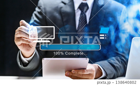 A professional businessman using a tablet and stylus to monitor a digital loading bar that is 100% complete on a virtual interface A professional businessman using a tablet and stylus to monitor a digital loading bar that is 100% complete on a virtual interface 138640802