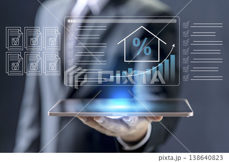 A professional holds a tablet displaying a digital dashboard for real estate investment, mortgage interest rates, property value growth charts, and document checklists A professional holds a tablet displaying a digital dashboard for real estate investment, mortgage interest rates, property value growth charts, and document checklists 138640823