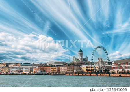 SkyWheel Helsinki and City Skyline Under Sweeping Clouds 138641006