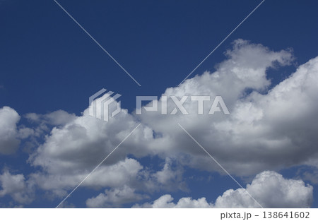Blue sky with puffy clouds Blue sky with puffy clouds 138641602