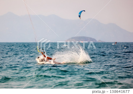 Kitesurfer wipeout sends dramatic spray across sea 138641677