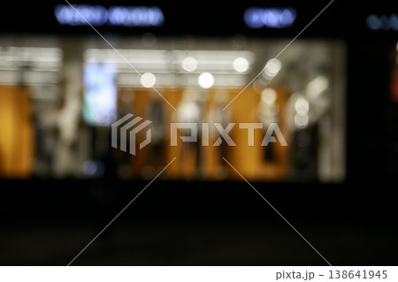 A yellow-colored nighttime window display. A yellow-colored nighttime window display. 138641945