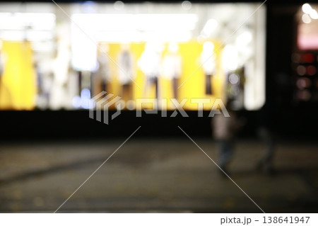 A yellow-colored nighttime window display. A yellow-colored nighttime window display. 138641947