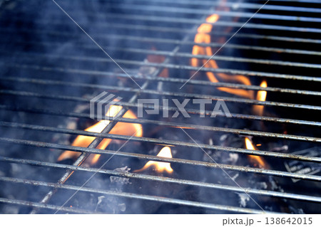 Outside BBQ Grill With Bright Flames And Glowing Coals ready for cooking on Outside BBQ Grill With Bright Flames And Glowing Coals ready for cooking on 138642015