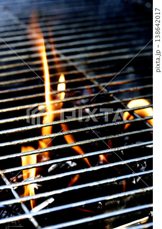 Outside BBQ Grill With Bright Flames And Glowing Coals ready for cooking on Outside BBQ Grill With Bright Flames And Glowing Coals ready for cooking on 138642017