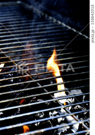 Outside BBQ Grill With Bright Flames And Glowing Coals ready for cooking on Outside BBQ Grill With Bright Flames And Glowing Coals ready for cooking on 138642018