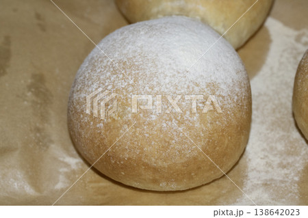 Home made bread roll baps freshly cooked with flour sprinkled on top Home made bread roll baps freshly cooked with flour sprinkled on top 138642023