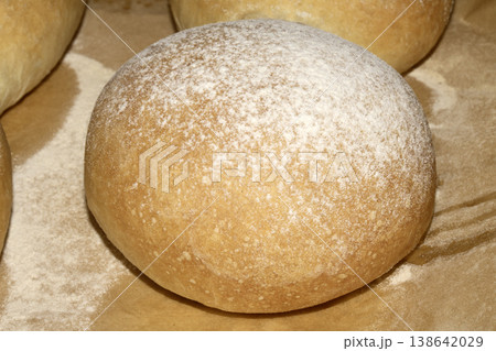 Home made bread roll baps freshly cooked with flour sprinkled on top Home made bread roll baps freshly cooked with flour sprinkled on top 138642029