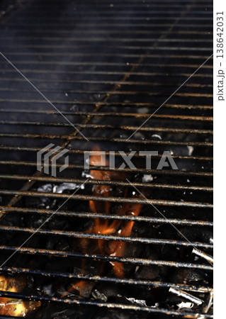 Outside BBQ Grill With Bright Flames And Glowing Coals ready for cooking on Outside BBQ Grill With Bright Flames And Glowing Coals ready for cooking on 138642031
