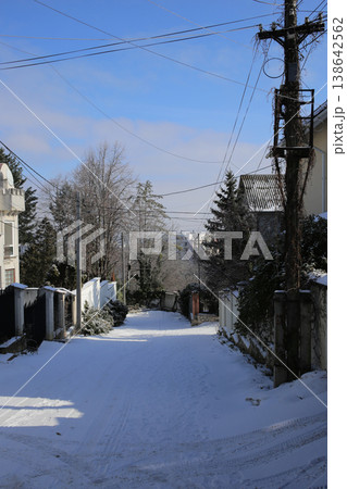 The alley is covered with fresh snow. Sunny day. The alley is covered with fresh snow. Sunny day. 138642562