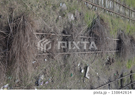 Railway tracks are littered with branches. Railway tracks are littered with branches. 138642614