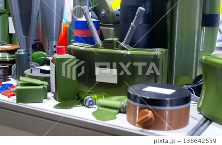 Models of military ammunition anti-personnel mine printed on 3D printer. 3D-printed military ammunition mock-ups. Prototype of ammunition printed on 3D printer. Innovation modern additive technologies 138642659