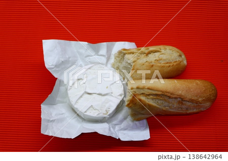 Still life with brie cheese and baguette. Still life with brie cheese and baguette. 138642964