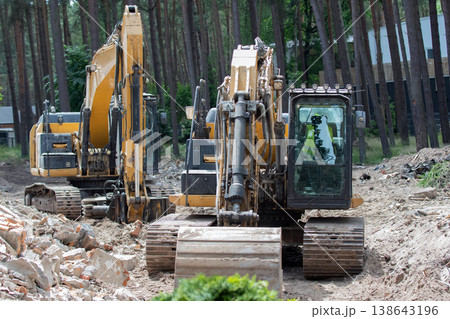 Excavators working Excavators working 138643196